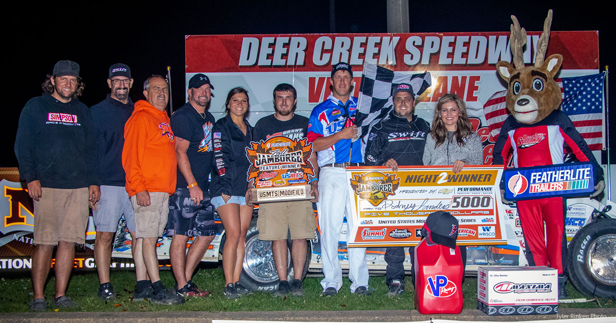 Rodney Sanders celebrates in victory lane with his family and crew members.