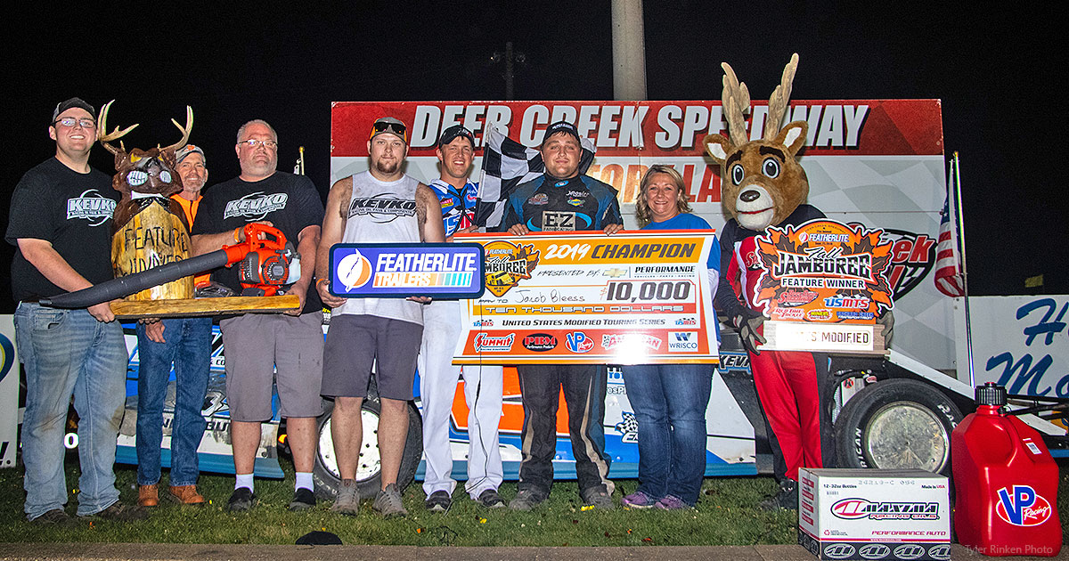 Jacob Bleess celebrates in victory lane with family and crew members.